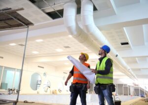 commercial-HVAC-workers-assessing-ductwork